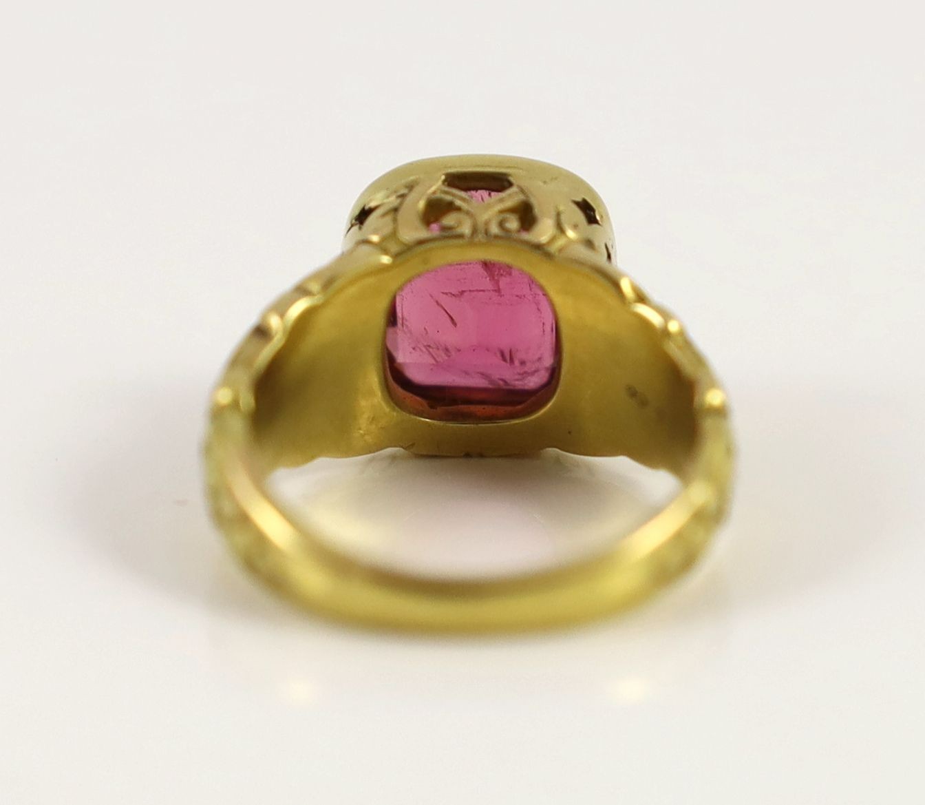 An antique Tiffany & Co gold and singe stone cushion cut rubellite set dress ring
